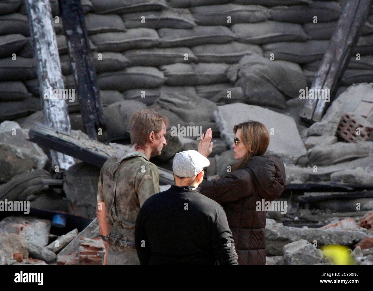 Angelina Jolie R Talks To Cast Members During The Filming Of Her First Movie Untitled Bosnian War Love Story In Central Budapest October 13 10 Jolie Will Direct Her First Feature Film