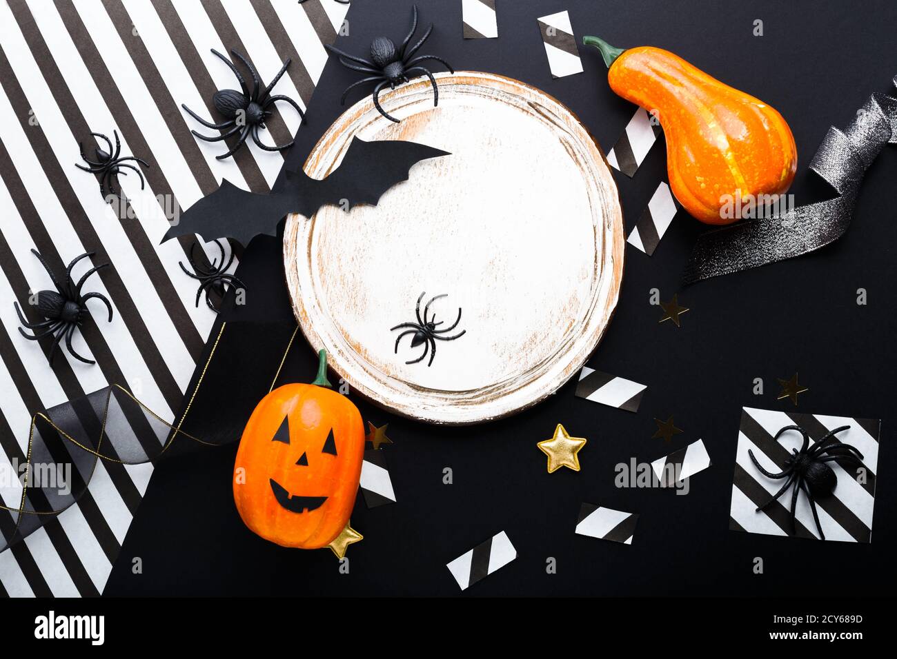 Halloween party invitation mockup, celebration. Frame. Halloween decorations concept with bats, spiders, jack-o'-lantern, stars, confetti, ribbon Stock Photo