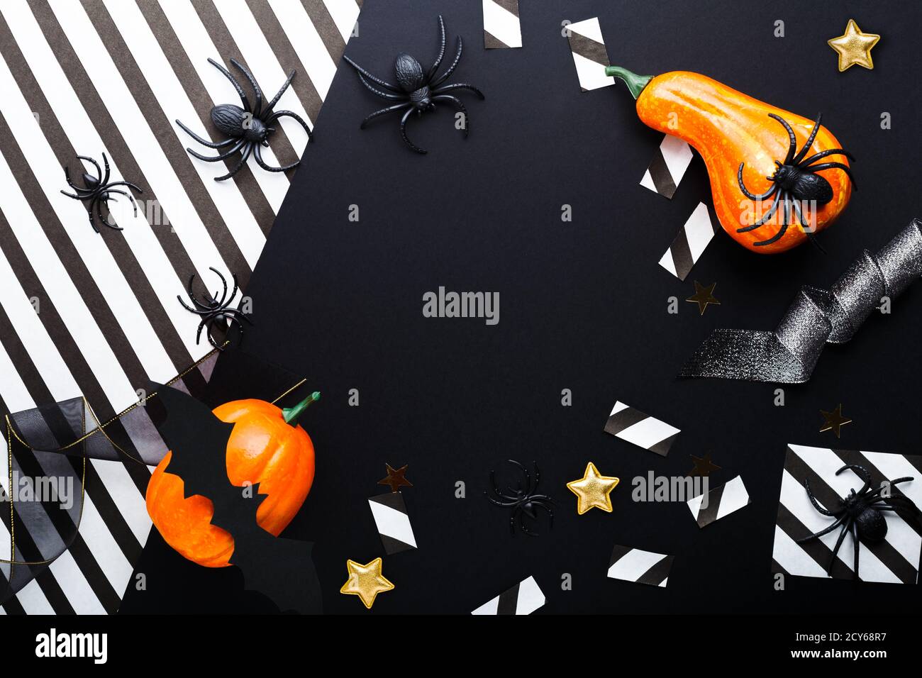 Halloween party invitation mockup, celebration. Frame. Halloween decorations concept with bats, spiders, jack-o'-lantern, stars, confetti, ribbon Stock Photo