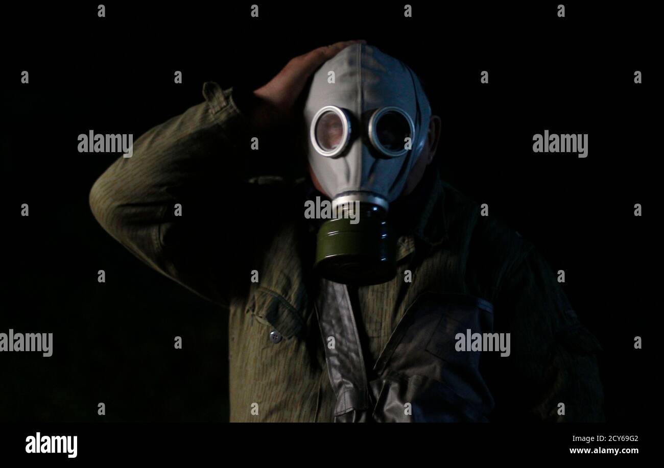65-year-old Hans-Georg Tiede wears a gas mask during the "reality event"  one night at the "Bunker-Museum" in Rennsteighoehe near the eastern city of  Ilmenau October 12, 2013. The museum is a former