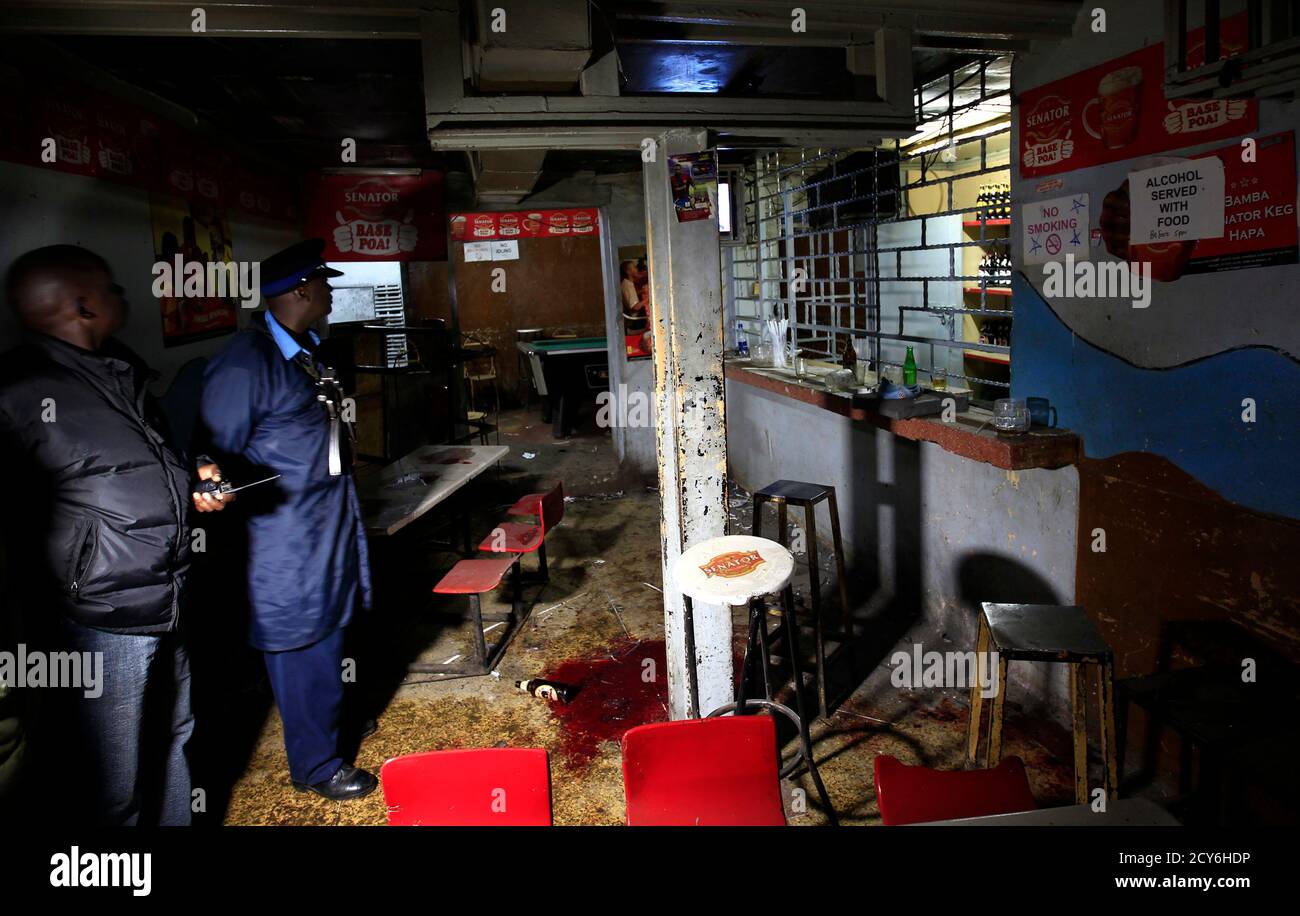Police inspect the scene of an explosion inside a club in Kenya's capital Nairobi October 24, 2011. A grenade attack on a club in the centre of Nairobi early on Monday wounded 14 people who needed hospital treatment, Kenyan media reported. REUTERS/Thomas Mukoya (KENYA - Tags: CIVIL UNREST TPX IMAGES OF THE DAY) Stock Photo