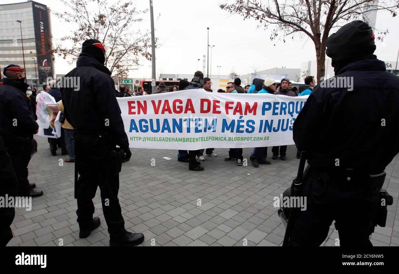 Riot Police Stand By As Workers From Spanish Telecommunications Company Telefonica Protest Against Job Cuts At
