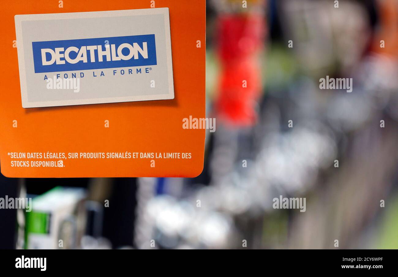 The logo of Decathlon is seen on a placard in an aisle at the French sports  equipment and sportswear company Decathlon store in Merignac near Bordeaux  July 10, 2014. The group, number