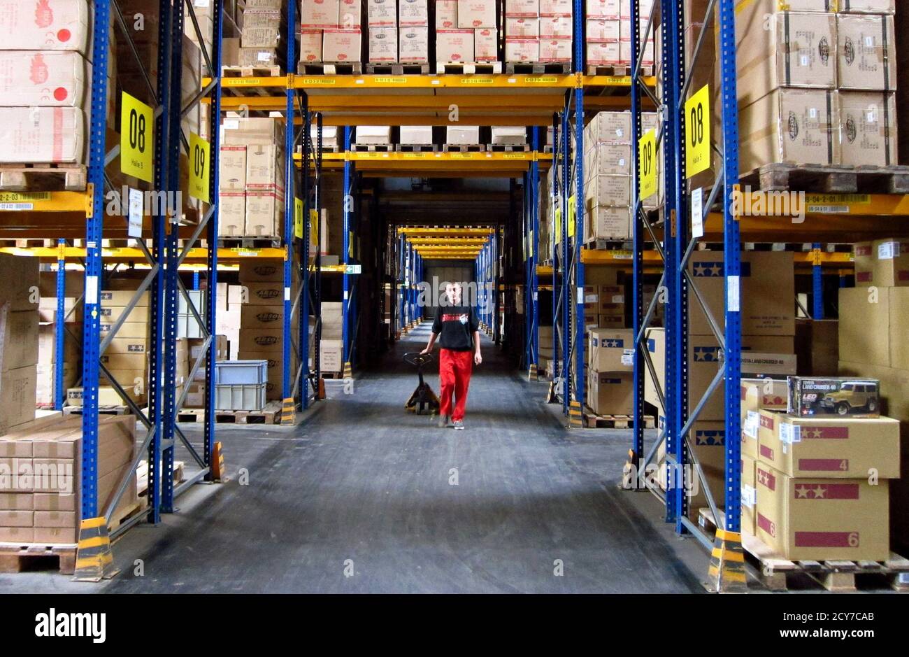 A worker pulls a pallet truck through one of the warehouses at toy company  Simba Dickie's logistics centre in Sonneberg, eastern Germany, October 9,  2014. Once hemmed in by the Iron Curtain,