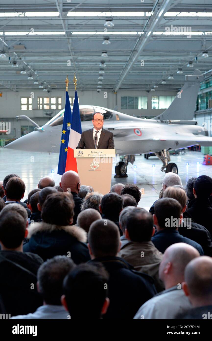French President Francois Hollande delivers a speech near a Rafale fighter jet at French aircraft manufacturer Dassault Aviation in Merignac, near Bordeaux March 4, 2015. The visit takes place after Egypt signed a 5.2 billion-euro deal in February to buy French weaponry, an agreement for 24 Rafale combat jets made by Dassault Aviation, a multi-mission naval frigate, and air-to-air missiles.   REUTERS/Caroline Blumberg/Pool   (FRANCE - Tags: POLITICS BUSINESS TRANSPORT MILITARY) Stock Photo