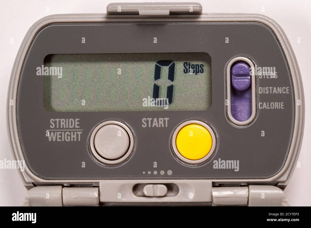 Macro image of small, inexpensive pedometer showing zero steps on the