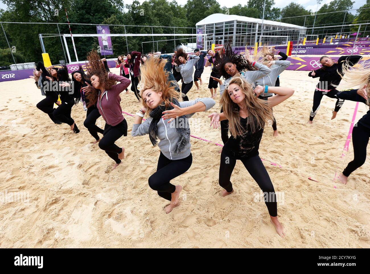 Dancers rehearse at the London 2012 Olympics beach volleyball venue in central London July 19, 2012. REUTERS/Suzanne Plunkett (BRITAIN - Tags: SPORT OLYMPICS SOCIETY VOLLEYBALL ENTERTAINMENT) Stock Photo