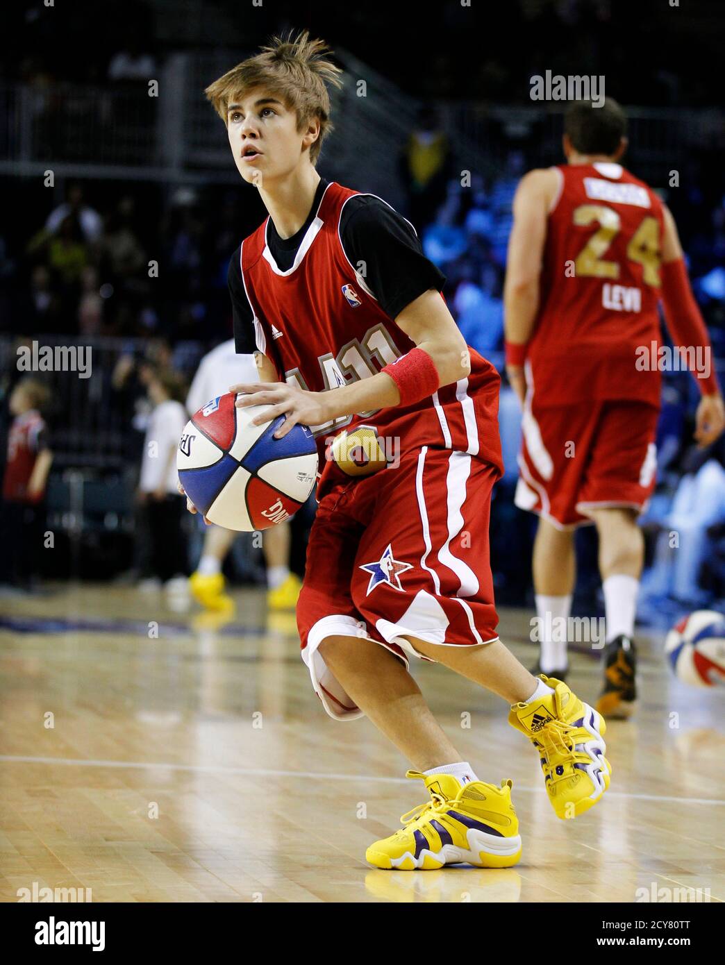 Recording artist Justin Bieber shoots the ball during a warm-up for the  2011 BBVA All-Star Celebrity basketball game as part of the NBA All-Star  basketball weekend in Los Angeles, February 18, 2011.