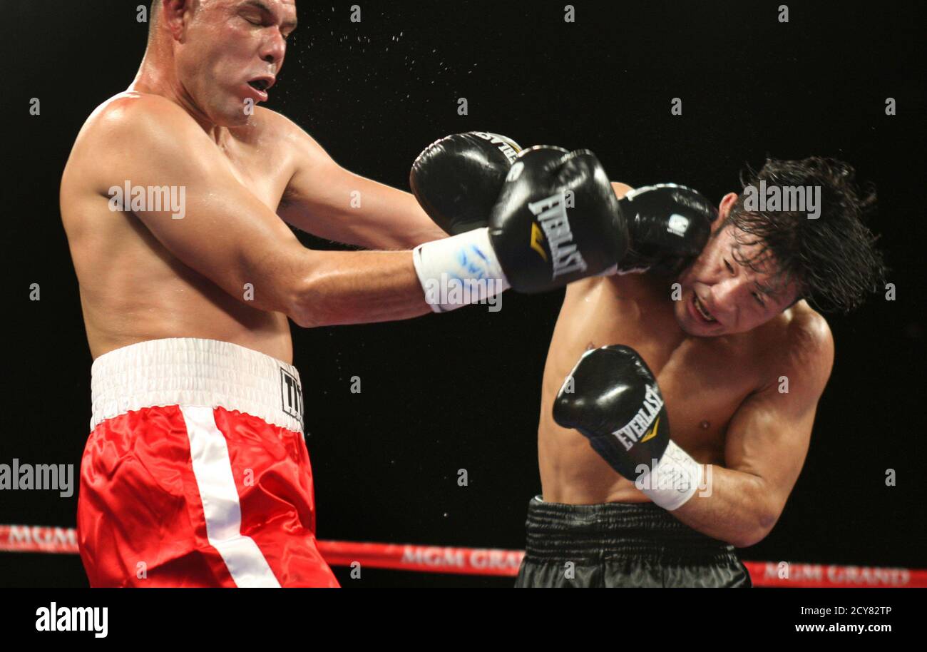 Super middleweight boxer Miura Hiromitsu (R) of Japan battles ...