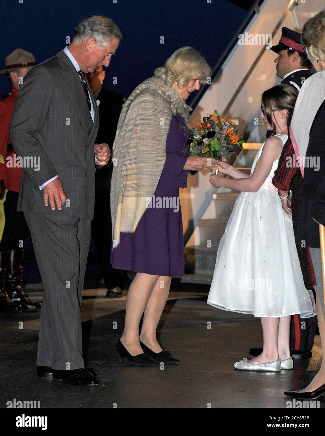 Britain S Prince Charles L And Wife Camilla Duchess Of Cornwall 2nd L Are Presented With Flowers From Renee Young After Arriving In Regina Saskatchewan May 22 12 Prince Charles And Wife Camilla Britain S Prince Charles L And Wife Camilla Duchess Of Cornwall 2nd L Are Presented With Flowers From Renee Young After Arriving In Regina Saskatchewan May 22 12 Prince Charles And Wife Camilla
