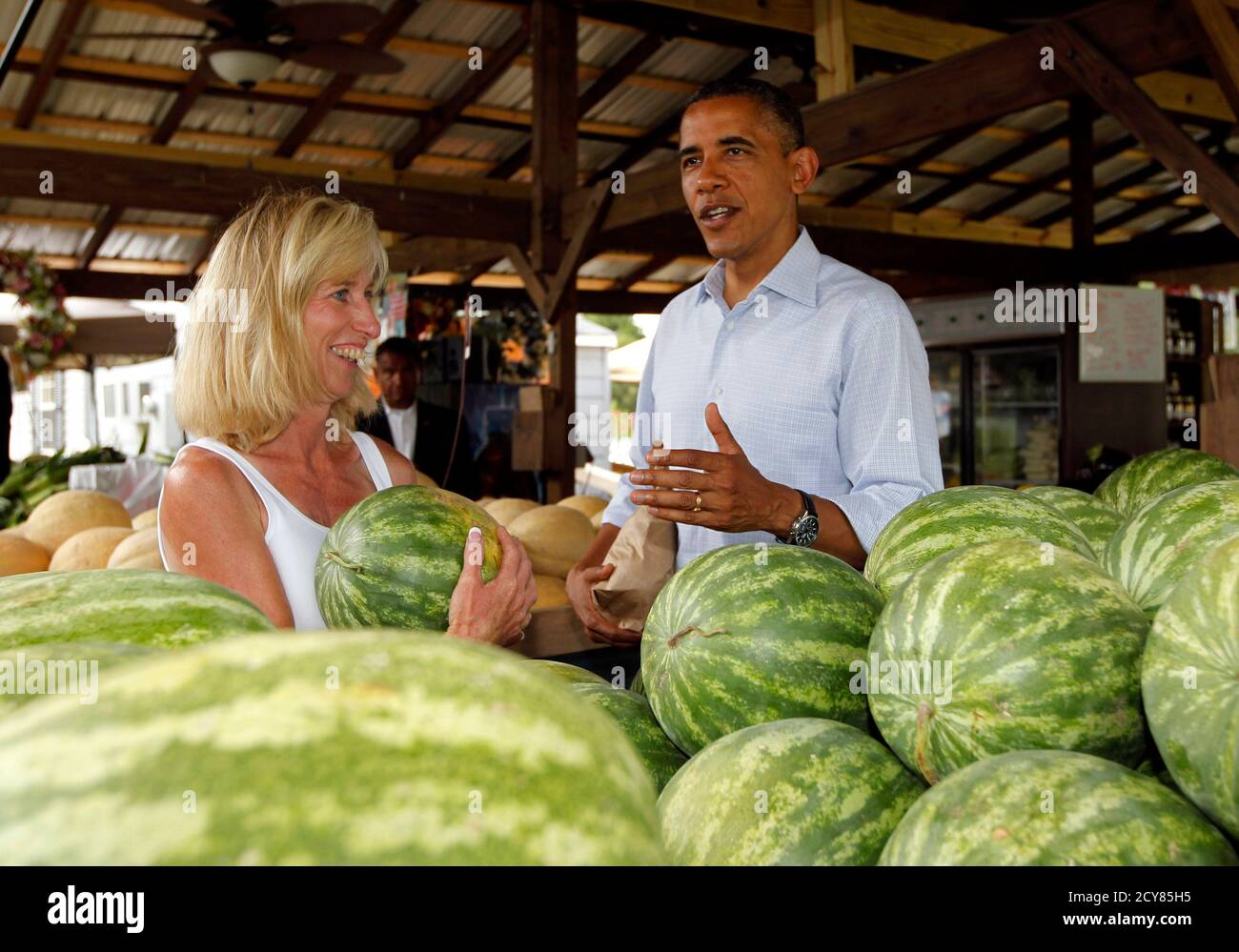 U S President Barack Obama Buys A Watermelon From Sandra Berry As He Stops To Buy Produce At Berry S Produce Market In Mechanicsville Virginia July 14 12 Obama Travelled To Virginia On Saturday U S President Barack Obama Buys A Watermelon From Sandra Berry As He Stops To Buy Produce At Berry S Produce Market In Mechanicsville Virginia July 14 12 Obama Travelled To Virginia On Saturday