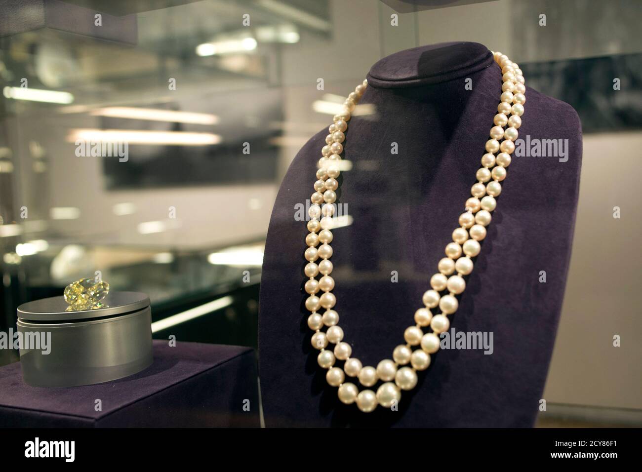 A double strand of natural pearls sits 
