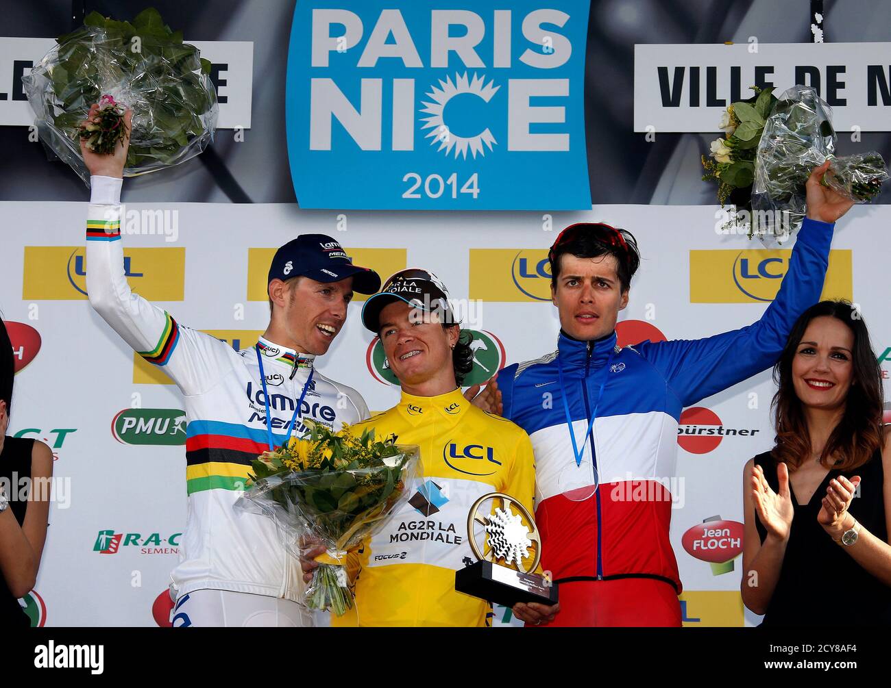 Ag2r Team Rider Carlos Alberto Betancur Gomez Of Colombia C Winner Of The 72nd Paris Nice Cycling Race Poses On The Podium With Second Placed Lampre Team Rider Rui Alberto Costa Of Portugal