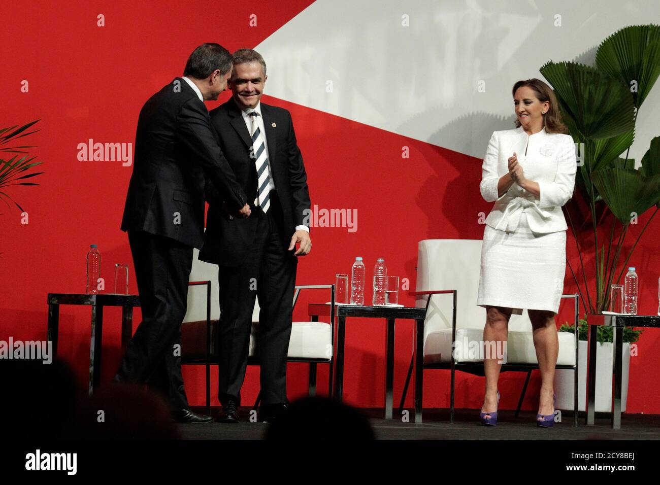 Alejandro Soberon Kuri Of Live Events Company Cie L Shakes Hands With Mexico City S Mayor Miguel Angel Mancera As Mexico S Minister Of Tourism Claudia Ruiz Massieu Applauds During A News Conference In