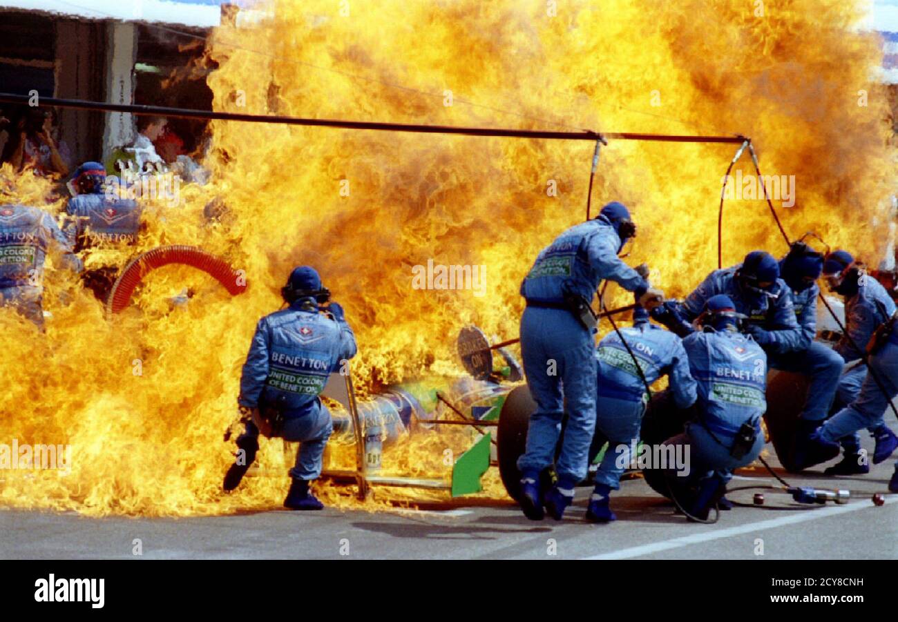 Petrol sprays on the Formula One racing car of Netherland's Jas Verstappen seconds before the car and the crew of Benetton Ford on fire during refueling at the German F-1 Grand