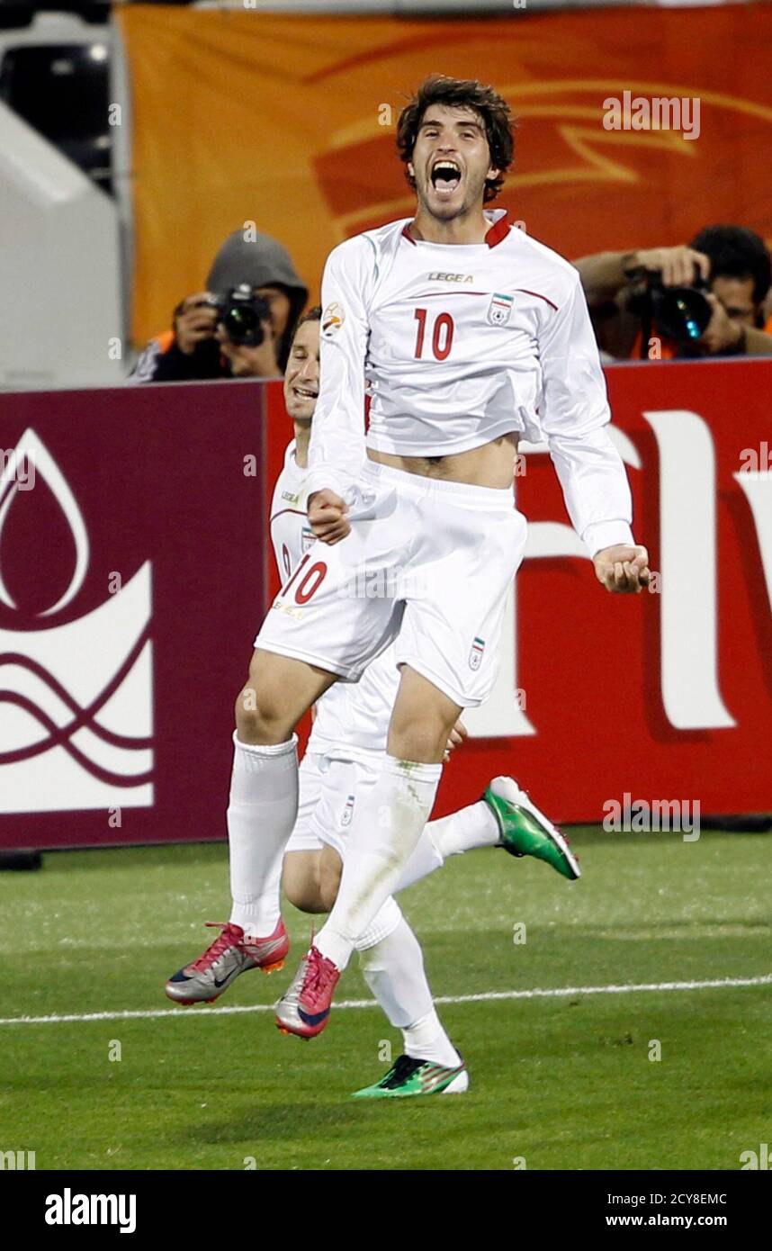 Iran's Karim Ansari Fard (10) celebrates his goal against North Korea  during their 2011 Asian Cup Group D soccer match at Qatar Sports Club  stadium in Doha January 15, 2011. REUTERS/Ahmed Jadallah (