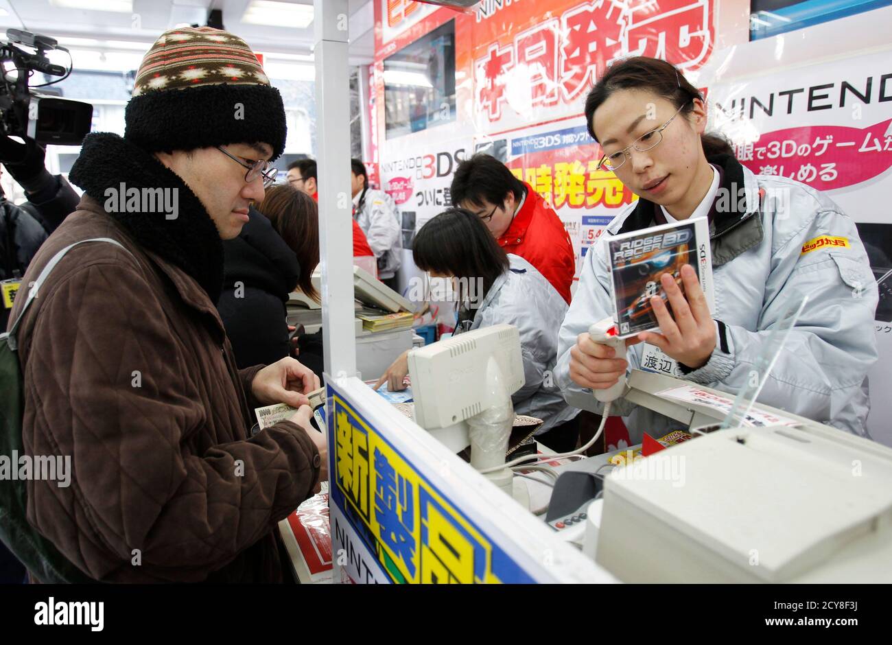 Toyohisa Ishihara L The First To Be In Line Purchases Nintendo S 3ds Game Player And Softwares At An Electronic Store In Tokyo February 26 11 Game Fans Jostling To Be Among The Toyohisa Ishihara L The First To Be In Line Purchases Nintendo S 3ds Game Player And Softwares At An Electronic Store In Tokyo February 26 11 Game Fans Jostling To Be Among The