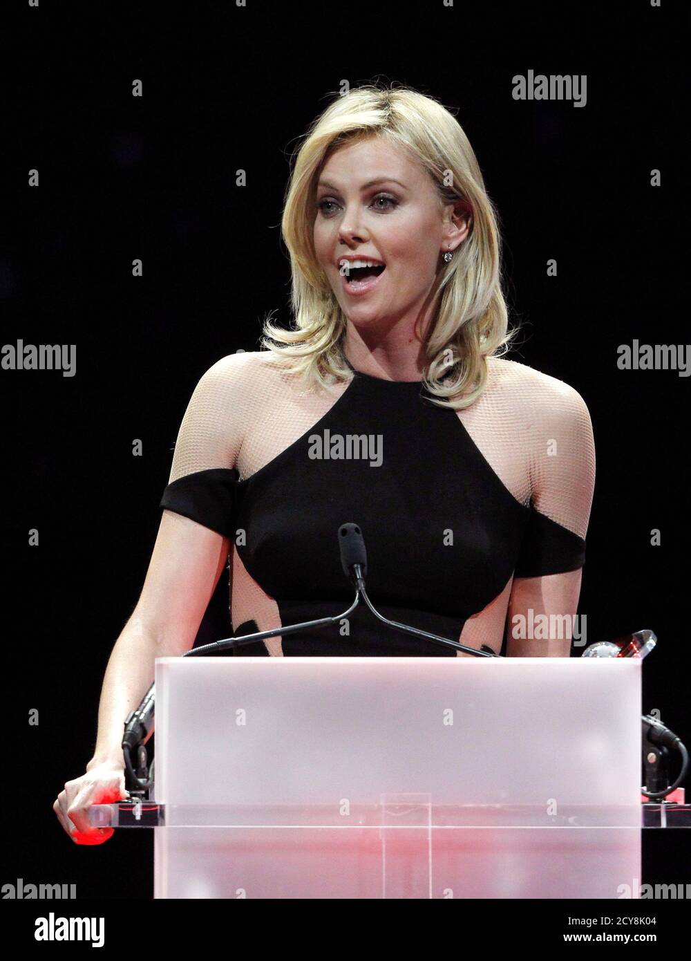 Actress Charlize Theron accepts the Distinguished Decade of Achievement in Film Award during the CinemaCon Big Screen Achievement Awards show at Caesars Palace in Las Vegas, Nevada, April 26, 2012. CinemaCon is the official convention for the National Association of Theatre Owners (NATO).  REUTERS/Steve Marcus (UNITED STATES - Tags: ENTERTAINMENT) Stock Photo