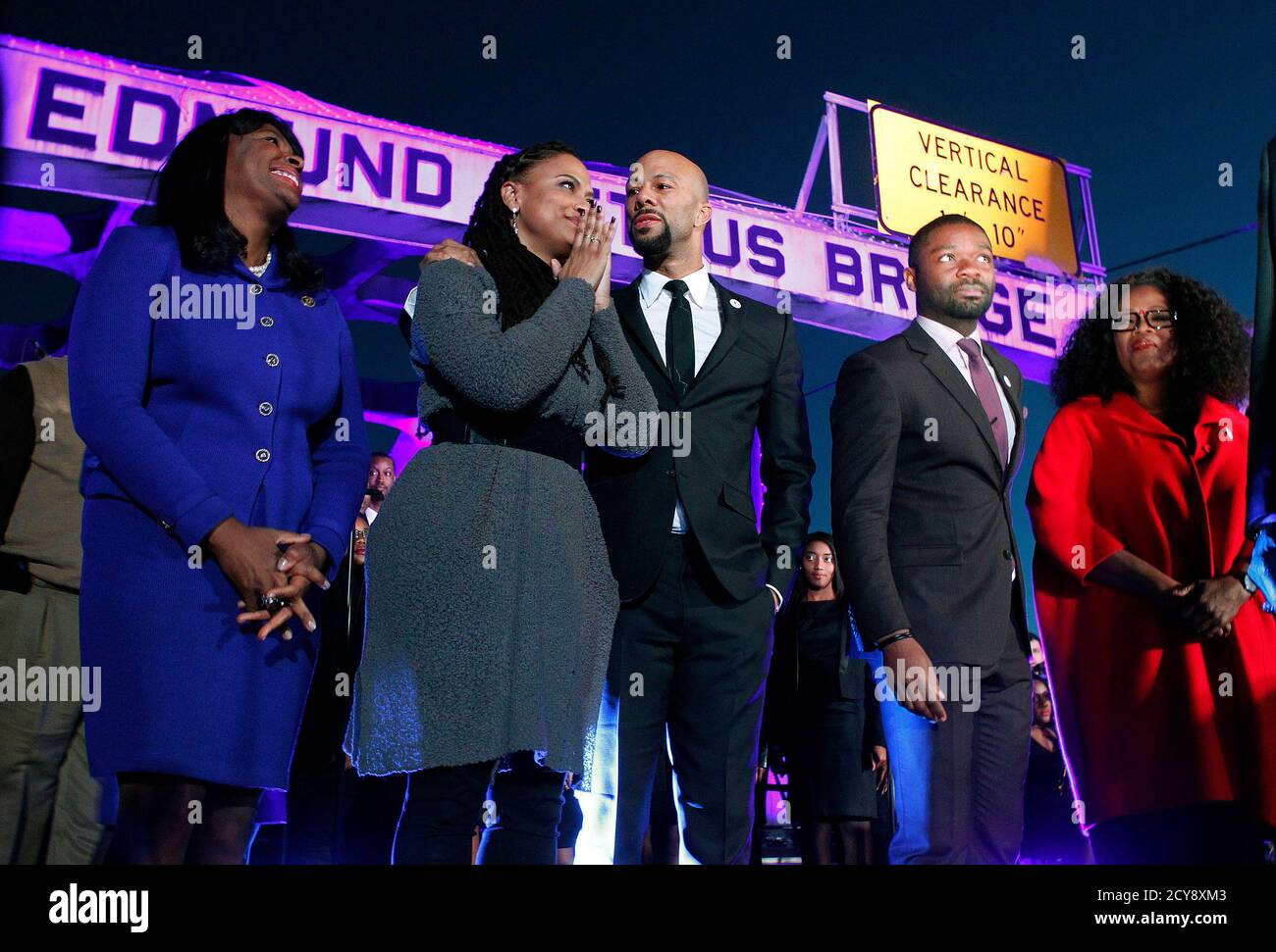 (L-R) Congresswoman Terri Sewell, director of the movie 'Selma' Ava DuVernay, cast members Common, David Oyelowo and producer Oprah Winfrey at the Edmund Pettus Bridge in Selma, Alabama January 18, 2015. Winfrey and other stars of the Oscar-nominated movie 'Selma' marched with thousands of people in the Alabama city on Sunday afternoon in honor of Martin Luther King Jr.'s birthday.   REUTERS/Tami Chappell  (UNITED STATES - Tags: ENTERTAINMENT ANNIVERSARY POLITICS) Stock Photo