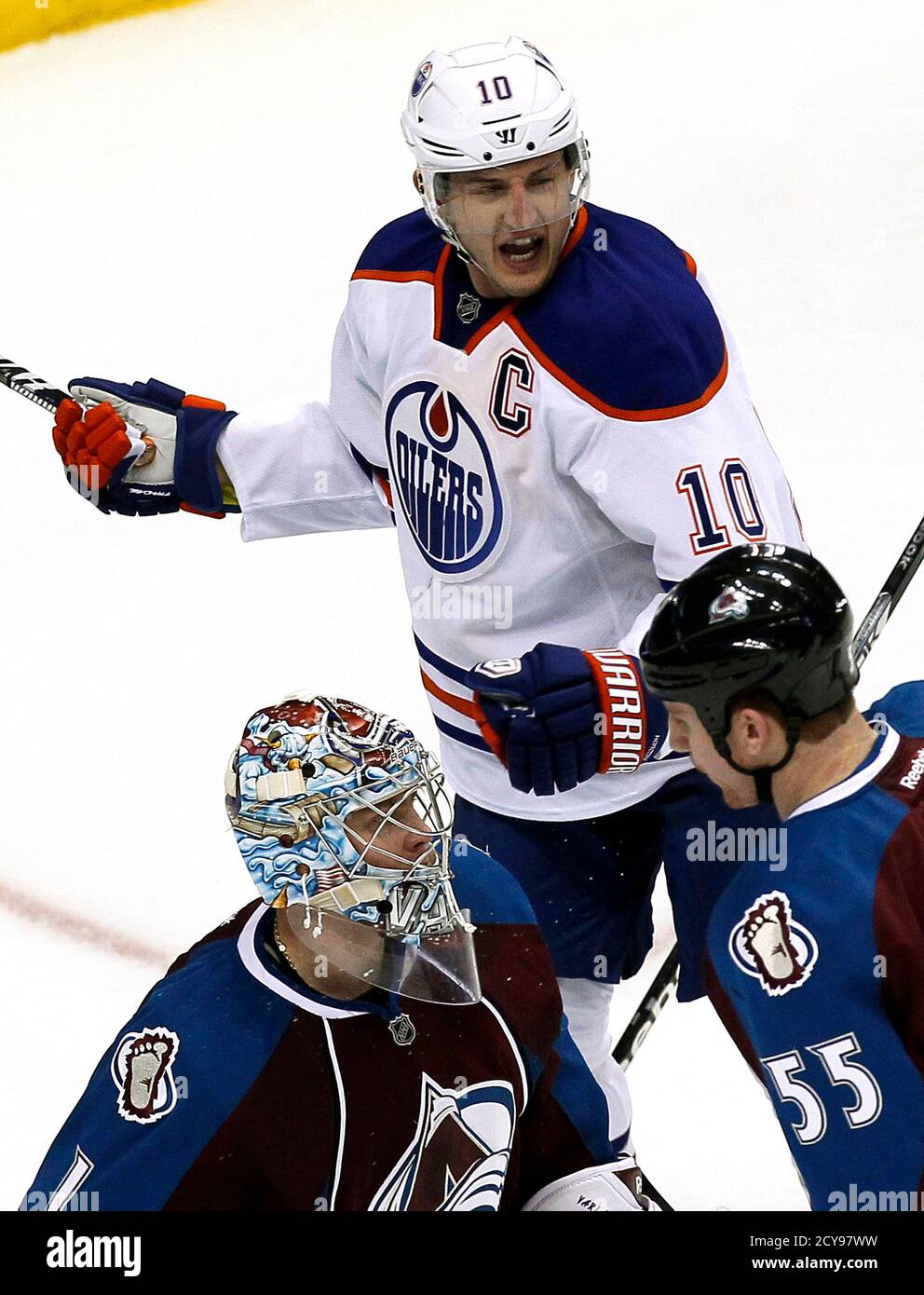 Edmonton Oilers Shawn Horcoff (10) celebrates a third period goal by teammate Ryan Nugent-Hopkins (not seen) past Colorado Avalanche goalie Semyon Varlamov (lower L) in their NHL hockey game in Denver March 12, 2013.  REUTERS/Rick Wilking (UNITED STATES - Tags: SPORT ICE HOCKEY) Stock Photo
