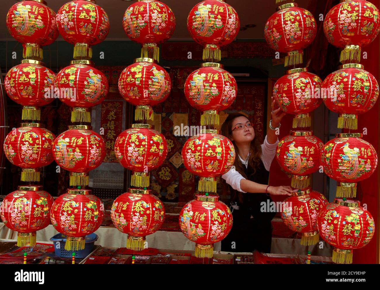 A Shopkeeper Arranges Chinese New Year Decorations In Tainan Southern Taiwan January 28 2011 The Lunar New Year Begins On February 3 And Marks The Start Of The Year Of The Rabbit The chinese believe that people born in a particular year take on the characteristics of the animal january february march april may june july august september october november december. alamy