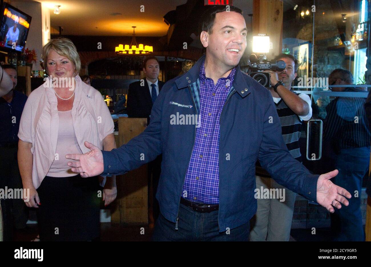 Ontario Progressive Conservative Party Leader Tim Hudak makes a campaign stop, with local candidate Sandie Bellows (L), at Johnny Rocco's Italian Grill in St. Catharines, Ontario, on Election Day October 6, 2011.  REUTERS/Fred Thornhill (CANADA - Tags: POLITICS ELECTIONS) Stock Photo