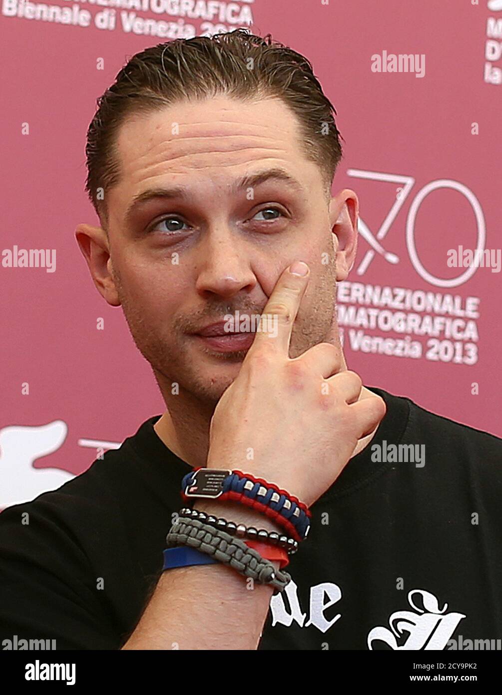 Cast Member Tom Hardy Scratches His Face During A Photocall For The Movie  "Locke", Directed By Steven Knight, During The 70th Venice Film Festival In  Venice September 2, REUTERS/Alessandro Bianchi (ITALY