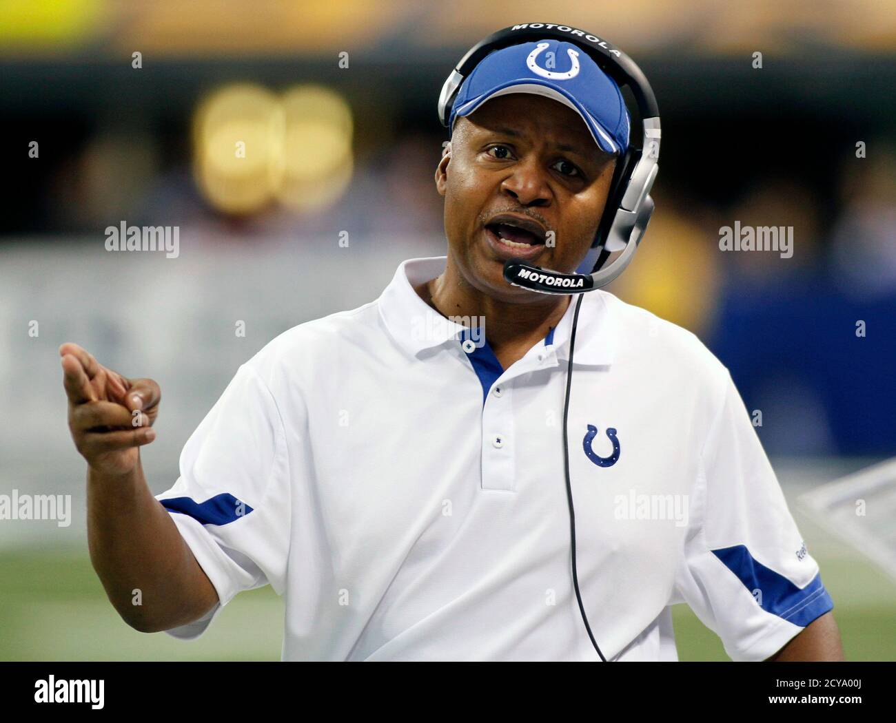 Indianapolis Colts head coach Jim Caldwell talks into his headset during  the fourth quarter of their NFL football game against the Jacksonville  Jaguars in Indianapolis December 19, 2010. REUTERS/Brent Smith (UNITED  STATES -
