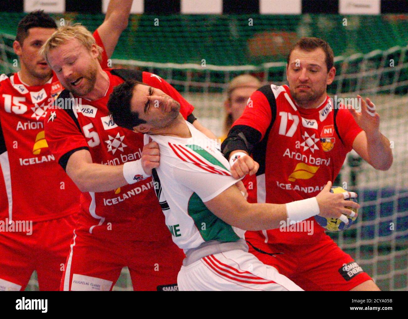 David Katzirz (C) of Hungary is challenged by Ingimundur Ingimundarson (L)  and Sverre Jakobsson of Iceland during their Group B match at the Men's  Handball World Championship in Norrkoping January 14, 2011.