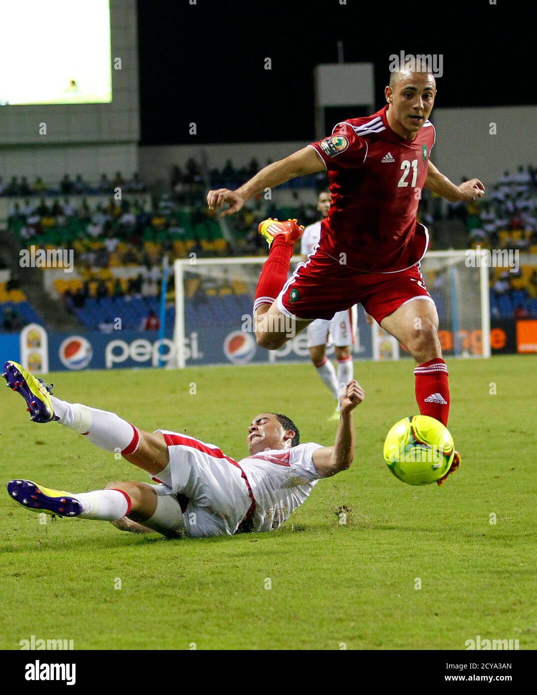 Morocco's Amrabat Noureddine (21) drives the ball over Tunisia's Jemal Ammar during their African Cup of Nations Group C soccer match at Stade De L'Amitie Stadium in Libreville January 23, 2012. REUTERS/Thomas Mukoya (GABON - Tags: SPORT SOCCER) Stock Photo