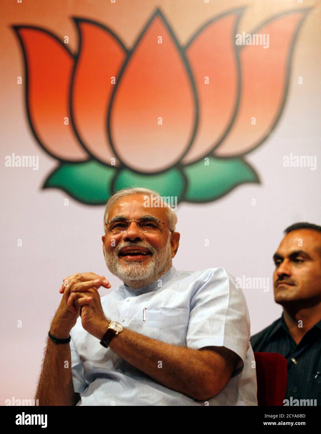 Narendra Modi, Chief Minister of India's western state of Gujarat, smiles  as he attends his party's Bharatiya Janata Party (BJP) legislative members  meeting at Gandhinagar on the outskirts of the western Indian