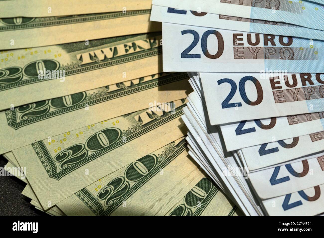 U.S. dollars and euros banknotes are seen in this illustration photo taken  at a change bureau in Paris, October 28, 2014. The global economy will  gradually improve over the next two years