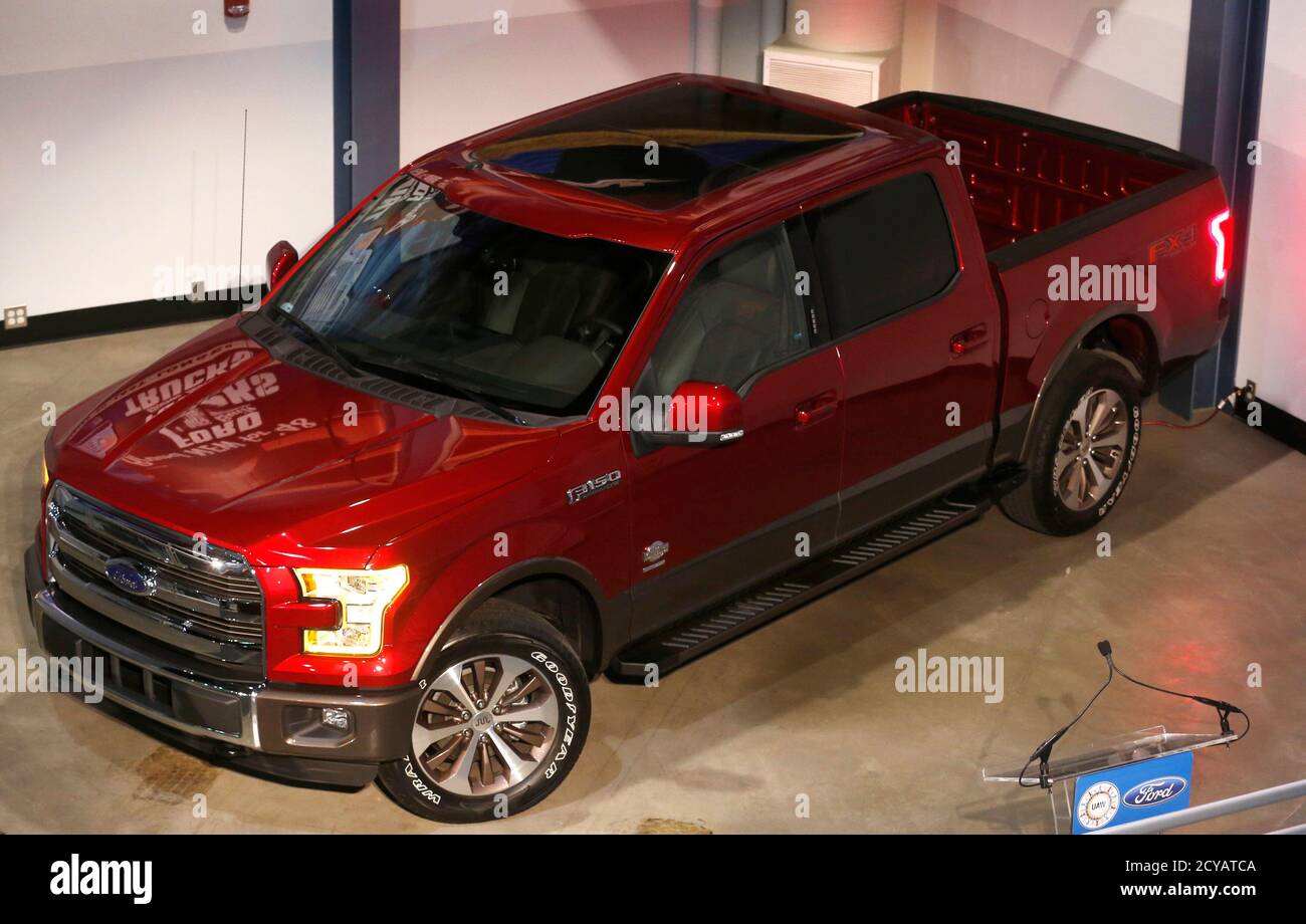 An all new Ford 2015 F-150 pick-up truck is displayed during a news conference at the Rouge Plant in Dearborn, Michigan, October 13, 2014.  Ford Motor Co said on Monday it will add 850 hourly jobs at its Dearborn, Michigan, facilities to support the launch of the redesigned, aluminum-intensive 2015 F-150 pickup truck. The No. 2 U.S. automaker said the new jobs are divided among three facilities: more than 500 jobs for the truck assembly plant, nearly 300 for the stamping factory and more than 50 at the diversified operations.  REUTERS/Rebecca Cook  (UNITED STATES - Tags: TRANSPORT BUSINESS EMP Stock Photo