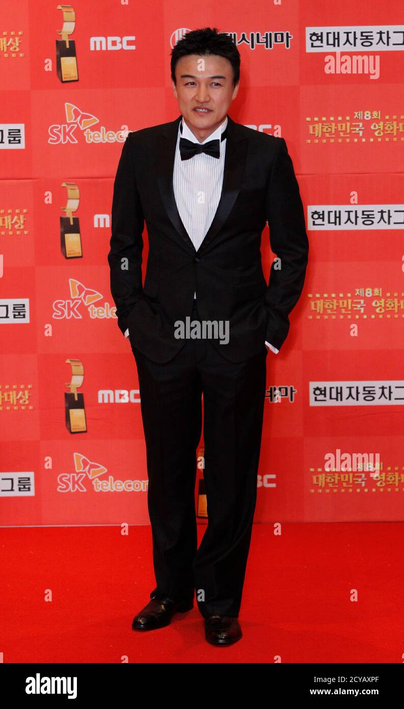 South Korean actor Park Joong-hoon poses for the media at the 8th Korea Film Awards in Seoul November 18, 2010.  REUTERS/Jo Yong-Hak (SOUTH KOREA - Tags: ENTERTAINMENT) Stock Photo
