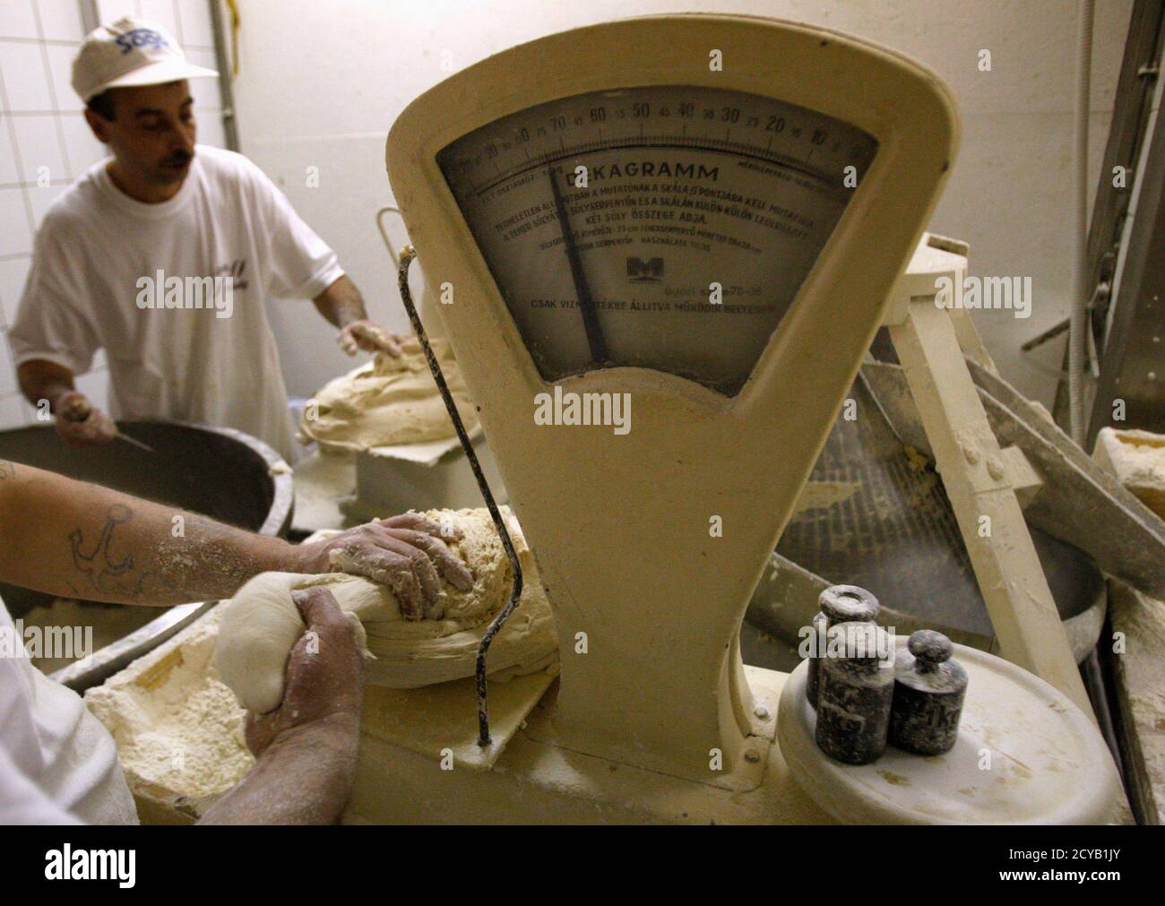 A Baker Weighs Dough In The Lipoti Bakery In Budapest November 3 2011 The Lipoti Bakery Started As A Small Family Venture In 1992 In Lipot Western Hungary And Grew Into A