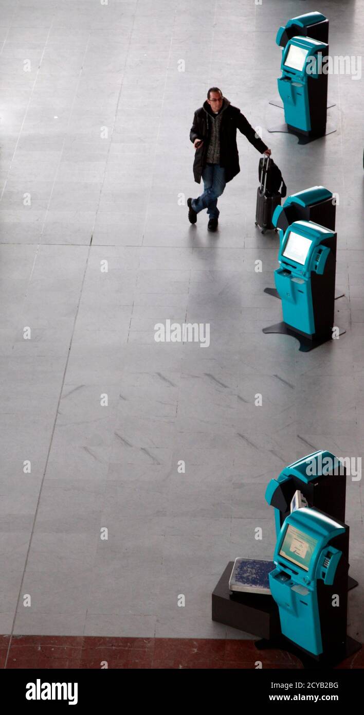 A Passenger Stands Next To Tickets Check In Machines At Nice International Airport February 7 2012 As The Main Pilots Union And Air France S Top Unions Called For A Four Day Strike Across The