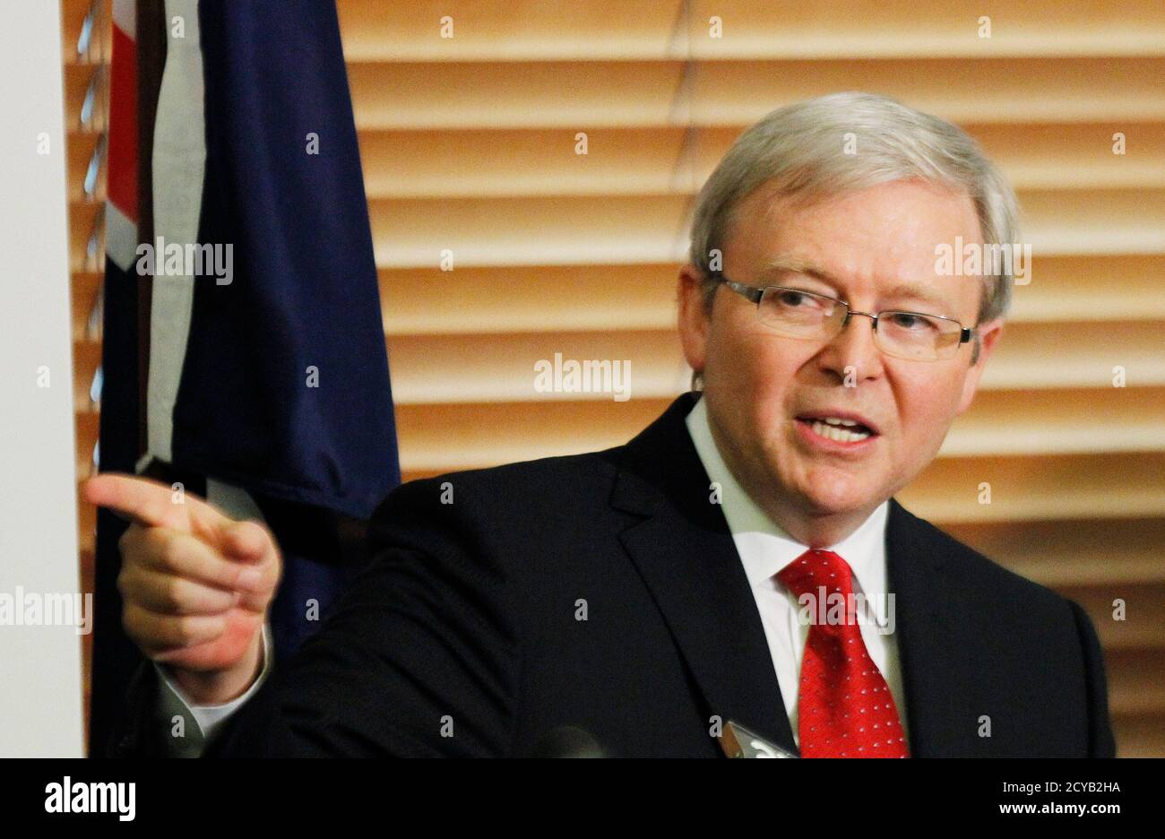 Australia's former Prime Minister Kevin Rudd reacts during a news  conference at Parliament House in Canberra