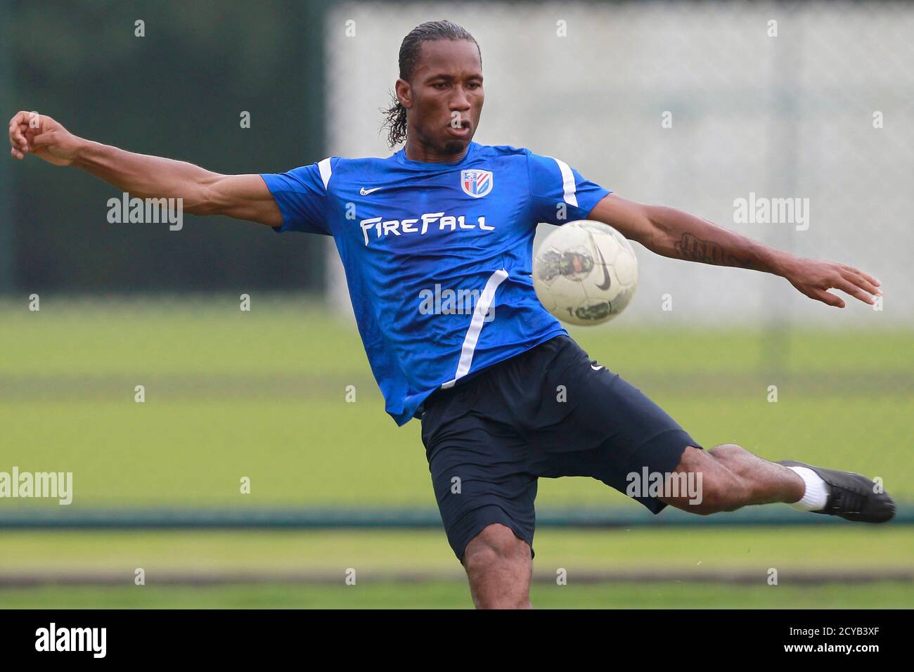 Shanghai Shenhua Striker Didier Drogba Of Ivory Coast Kicks A Ball During A Training Session In Shanghai July 16 12 Drogba Has Signed A Two And A Half Year Contract With The Big Spending Chinese Super League