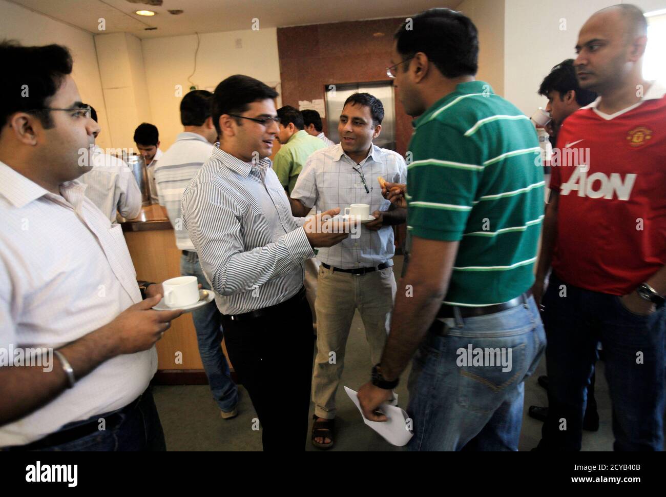 Master of Business Administration (MBA) students share a moment during a  break from their class at the Management Development Institute (MDI) in  Gurgaon, on the outskirts of New Delhi May 2, 2012.