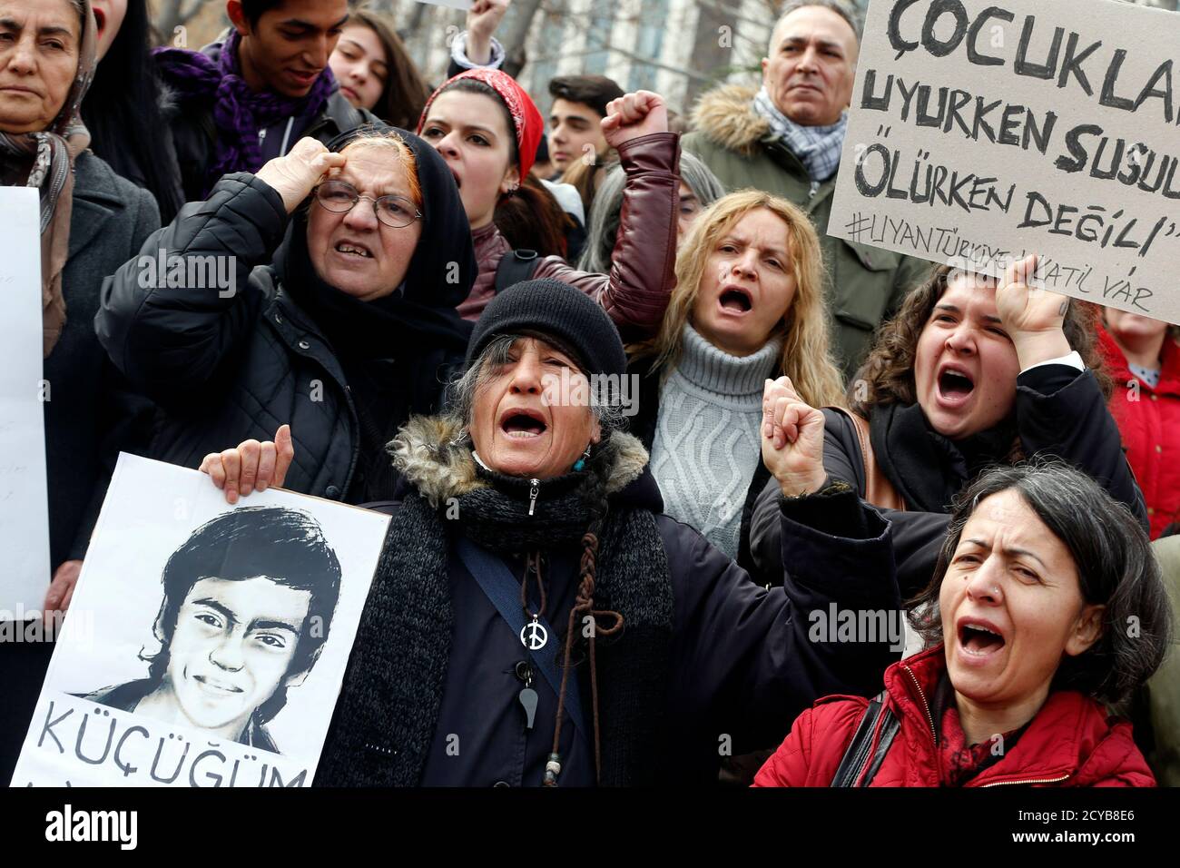 Anti-government protesters shout slogans during a demonstration marking the funeral of Berkin Elvan in Ankara March 12, 2014. Several thousand mourners gathered in central Istanbul and Ankara on Wednesday for the funeral of Elvan, a 15-year-old boy wounded during anti-government demonstrations last summer whose death on Tuesday triggered protests across Turkey. REUTERS/Umit Bektas (TURKEY  - Tags: POLITICS CIVIL UNREST) Stock Photo