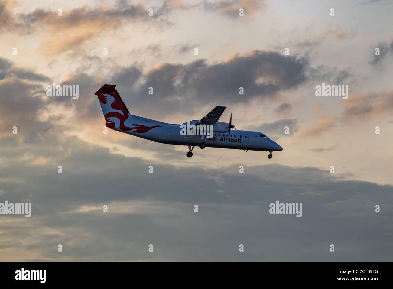 Montreal, Quebec / Canada - 07/15/2020 : Air Inuit Dash 8-300 landing at Montreal's Trudeau airport on a summer's evening. Stock Photo