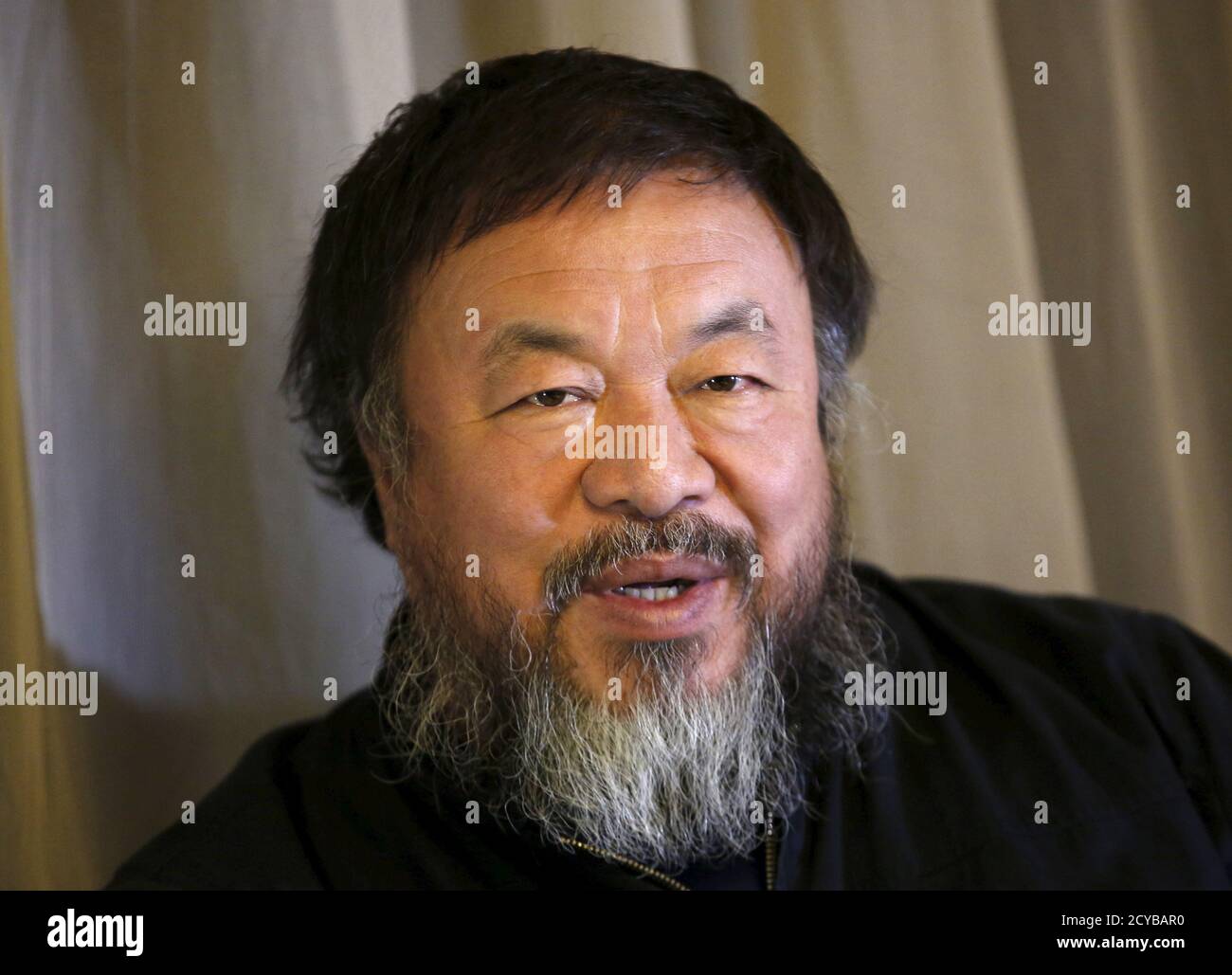 Dissident Chinese artist Ai Weiwei speaks during an interview with Reuters at his hotel in Beijing March 24, 2015. Amnesty International has given its top 2015 human rights award to both Chinese dissident artist Ai Weiwei, a fierce critic of Beijing who has been banned from leaving China after an 81-day detention in 2011, and U.S. folksinger Joan Baez.   REUTERS/Kim Kyung-Hoon Stock Photo