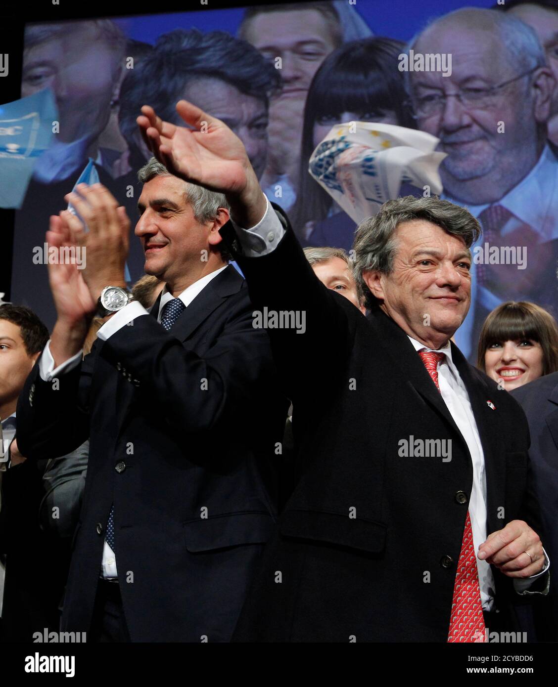 Jean-Louis Borloo (R), French deputy and President of the French Radical  Party, waves to supporteres as he stands by former Defense minister Herve  Morin (L) after a two-day congress of his party