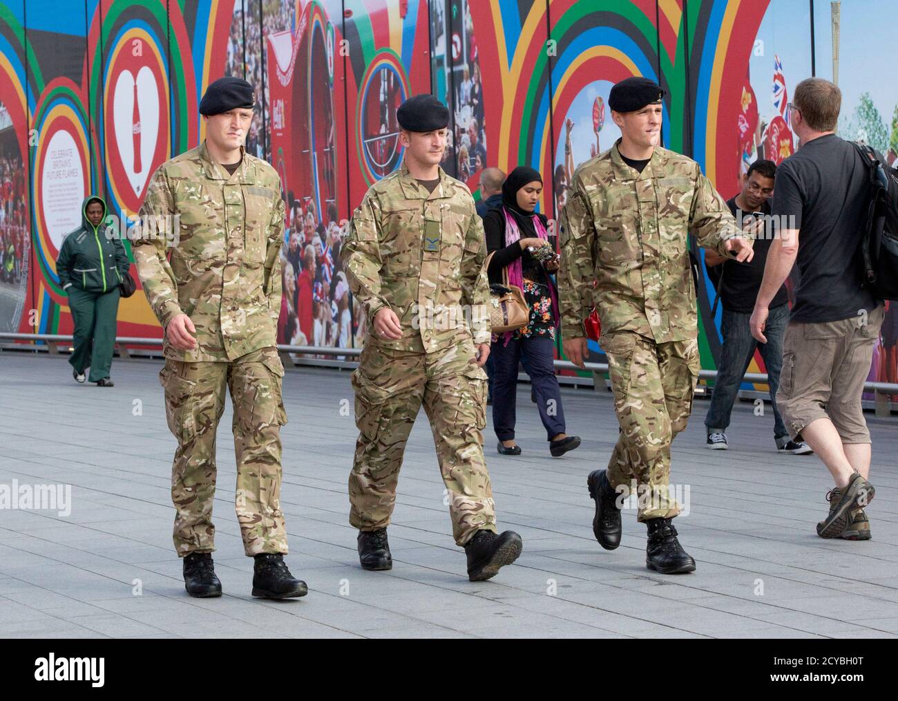 Members of the armed forces walk through the Westfield Shopping Centre, a major gateway for visitors to the London 2012 Olympic Park, in Stratford, east London July 19, 2012. REUTERS/Neil Hall (BRITAIN - Tags: SPORT OLYMPICS BUSINESS MILITARY) Stock Photo