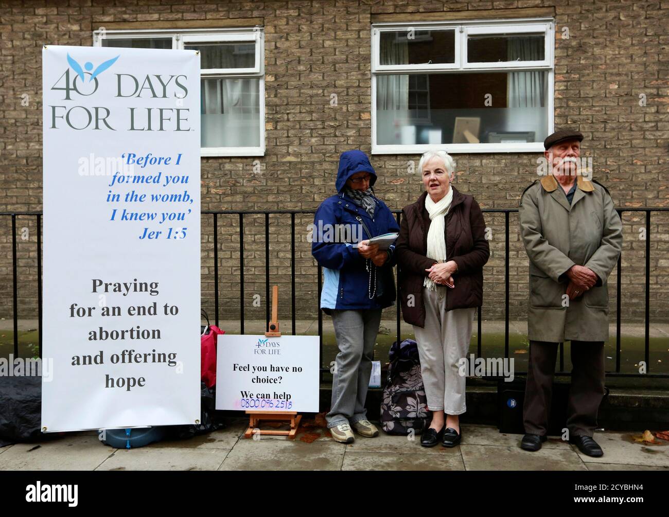 Campaigners from the 40 Days for Life anti-abortion campaign hold a prayer vigil opposite a Marie Stopes family planning clinic in London September 26, 2012. The U.S. group on Wednesday began a 40-day vigil outside nine clinics and hospitals in Britain. REUTERS/Olivia Harris   (BRITAIN - Tags: HEALTH SOCIETY RELIGION CIVIL UNREST) Stock Photo
