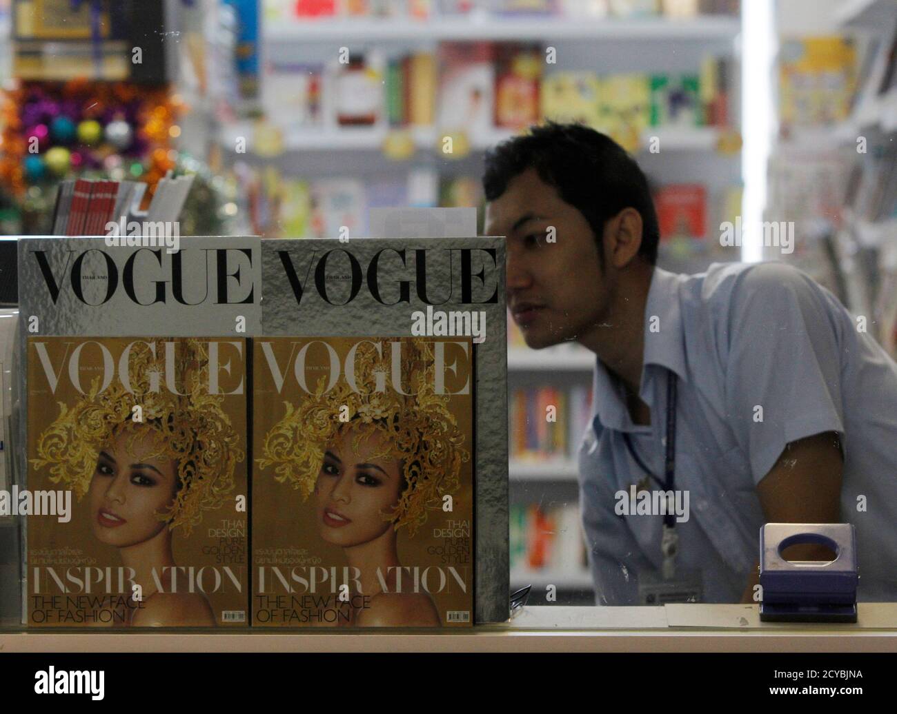 A Bookseller Works Near Copies Of The Thai Edition Of Vogue Magazine As He Waits For Customers At A Bookstore In Bangkok January 25 13 The Fashion Bible S Launch In Thailand On A Bookseller Works Near Copies Of The Thai Edition Of Vogue Magazine As He Waits For Customers At A Bookstore In Bangkok January 25 13 The Fashion Bible S Launch In Thailand On