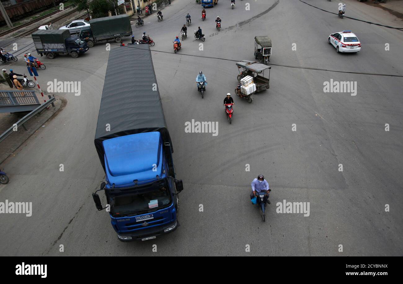 A Truck Travels Past A Traffic Police Check Point Outside Hanoi April 8 2014 The Movement