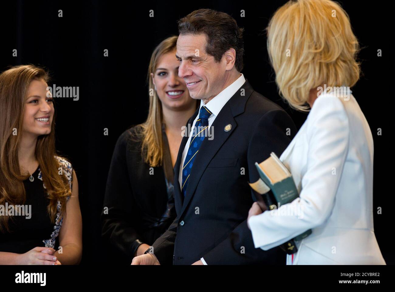New York Governor Andrew Cuomo Smiles After He Is Sworn In During An Inaugural Ceremony At One World Trade Center In New York January 1 2015 From Left Are His Daughters Cara