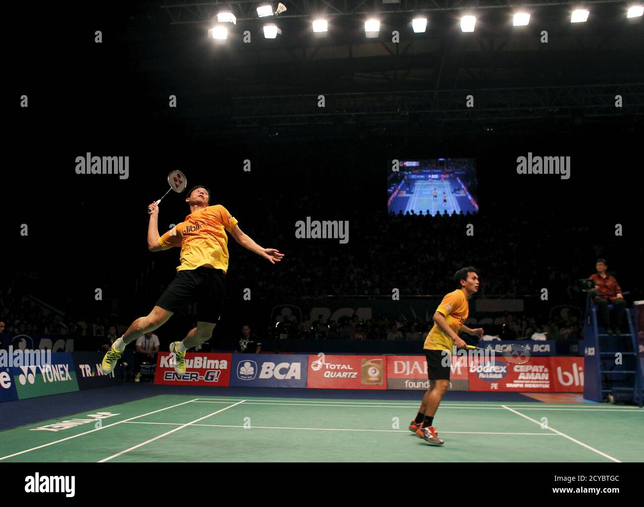 Indonesia's Hendra Setiawan (L) prepares to make a return over his partner  Mohammad Ahsan (R) during their semi final men's doubles match against  China's Zhang Nan and Fu Haifeng at the 2015