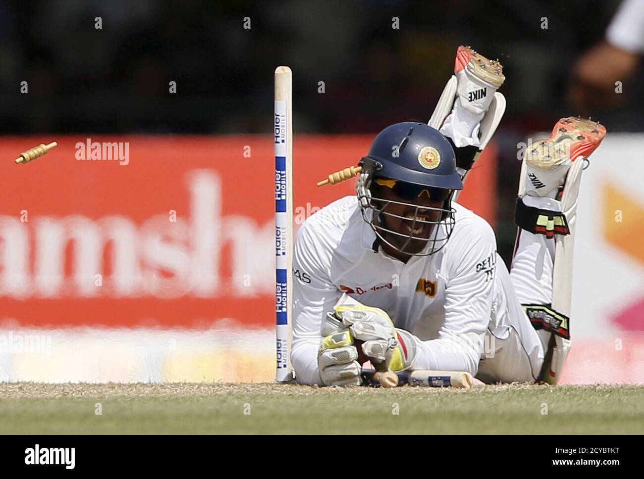 Sri Lanka's wicketkeeper Dinesh Chandimal runs out Pakistan's captain Misbah-ul-Haq (not pictured) during the first day of their second test cricket match in Colombo June 25, 2015.  REUTERS/Dinuka Liyanawatte         TPX IMAGES OF THE DAY Stock Photo